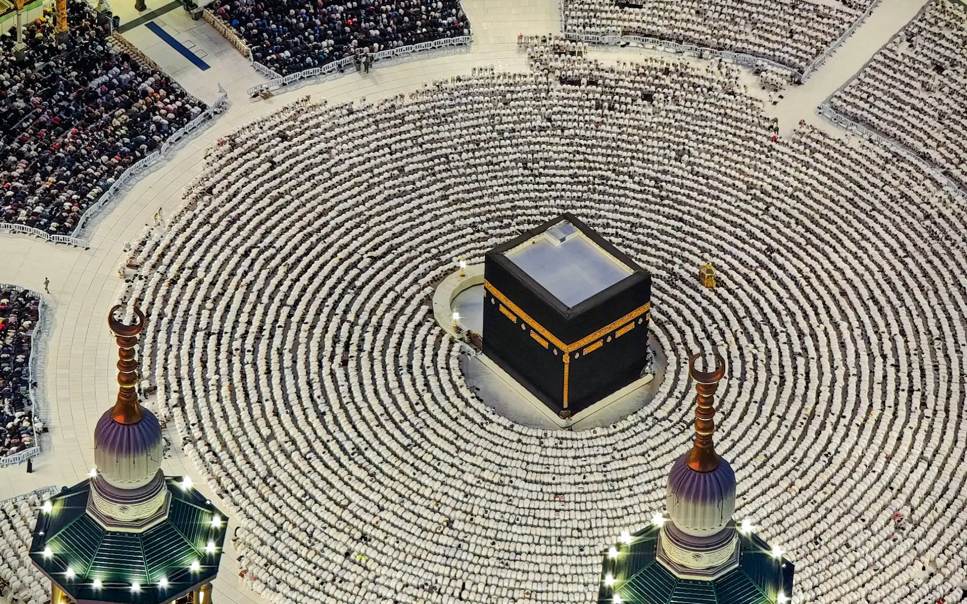 Aerial view of worshippers in rows around the Holy Kaaba at Masjid al-Haram, Makkah, at night